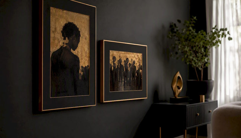 Wall with portrait and landscape framed black art