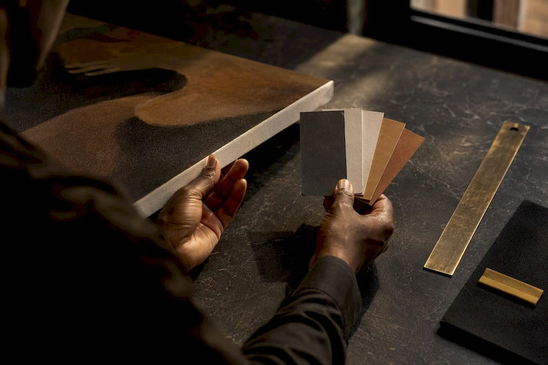 Curator examining archival art print materials