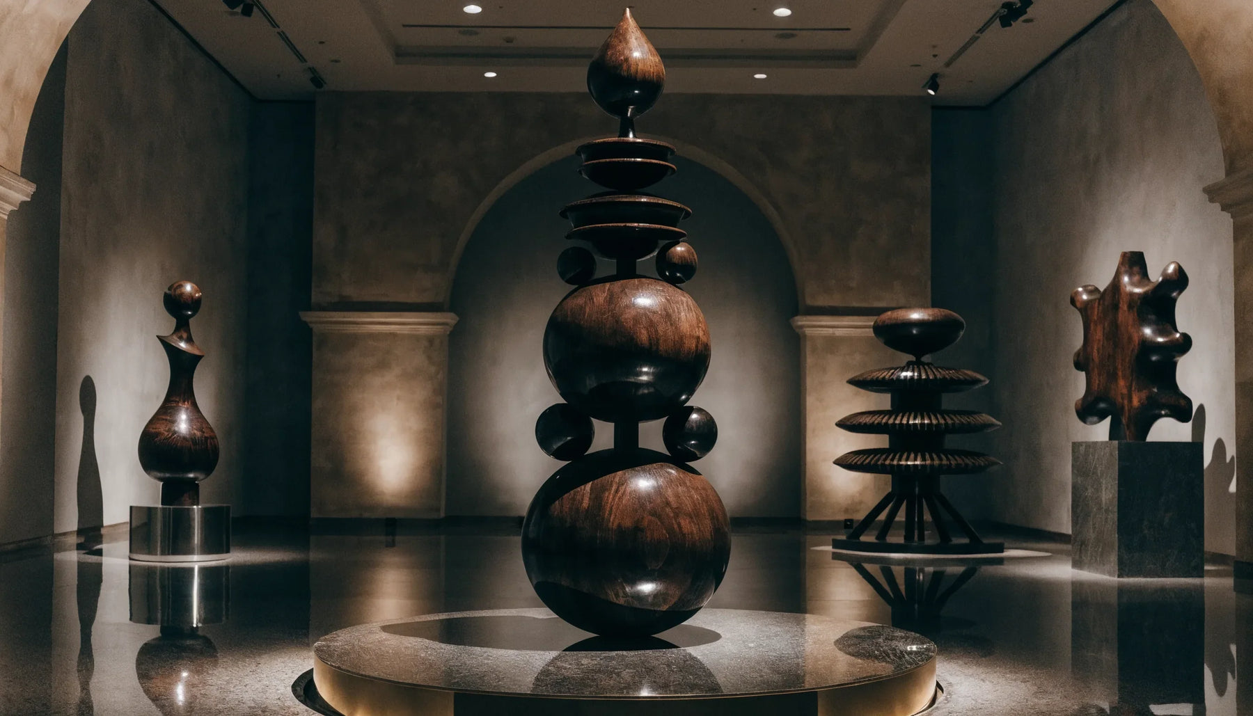 A dramatic museum exhibition of bold Afrofuturist artworks under theatrical lighting, deep shadows, no people.