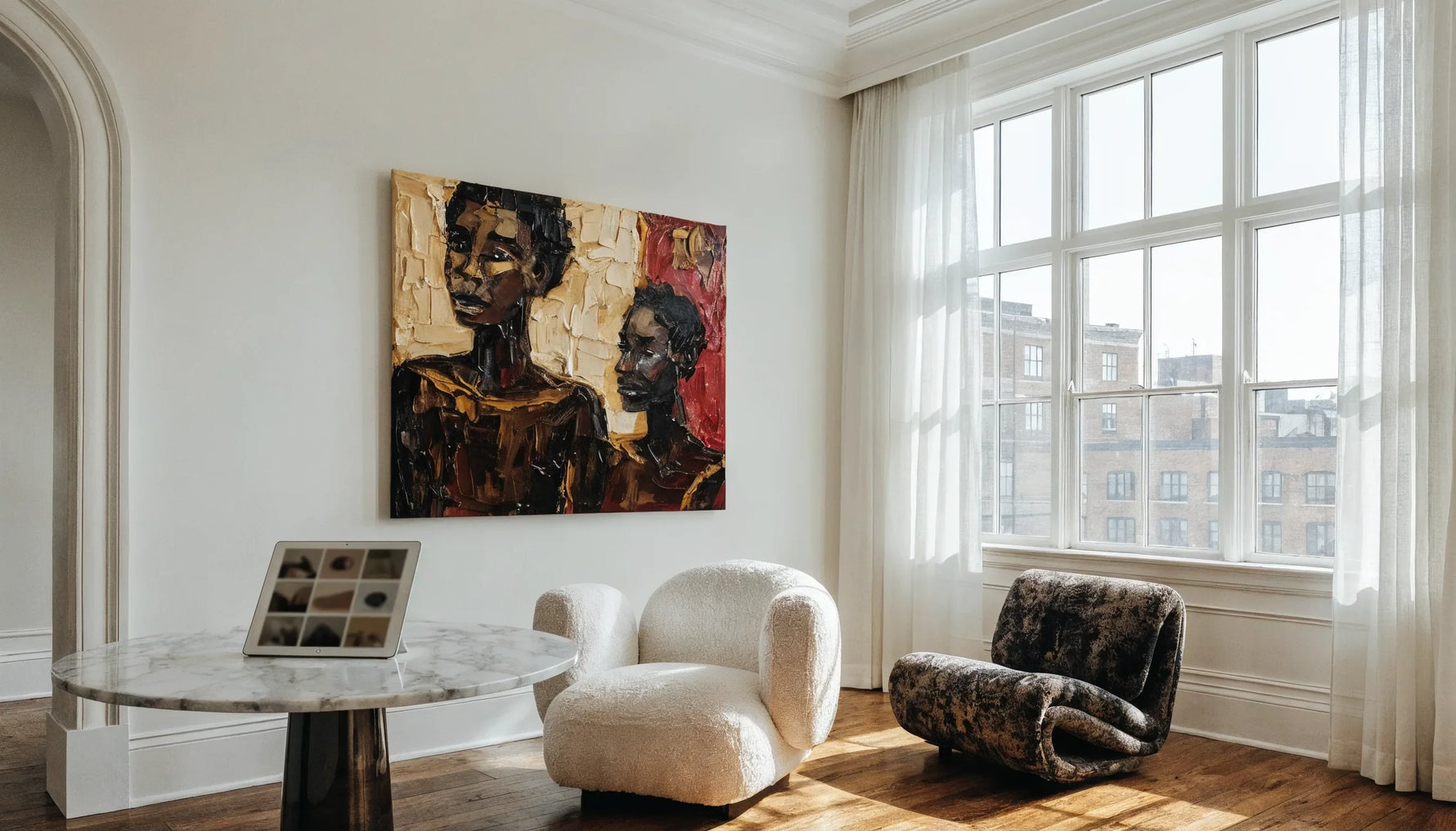 Modern apartment with a bold original Black-art painting and a tablet showing an art grid