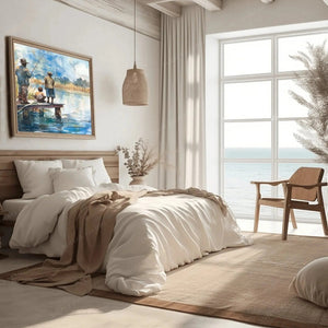 Black art for the bedroom, fishing watercolor above linen bedding in a coastal room with an ocean view