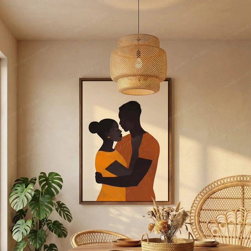 African American dining room art, couple embrace canvas under a rattan pendant beside a monstera in a boho dining room