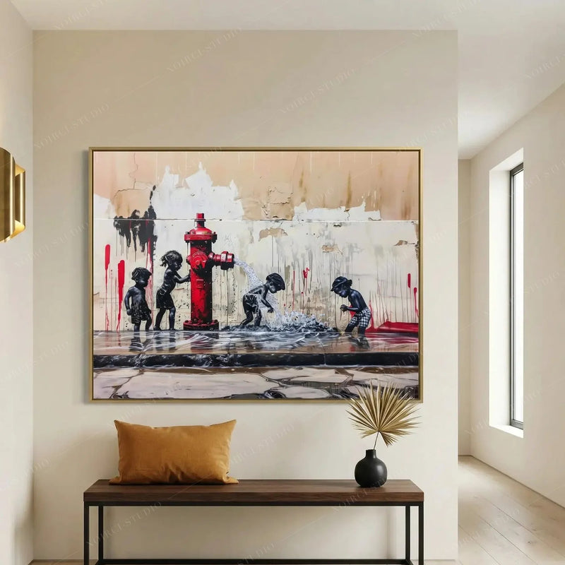 Black family wall art in a gold frame above an entryway bench with a mustard cushion and dried palm in a dark vase