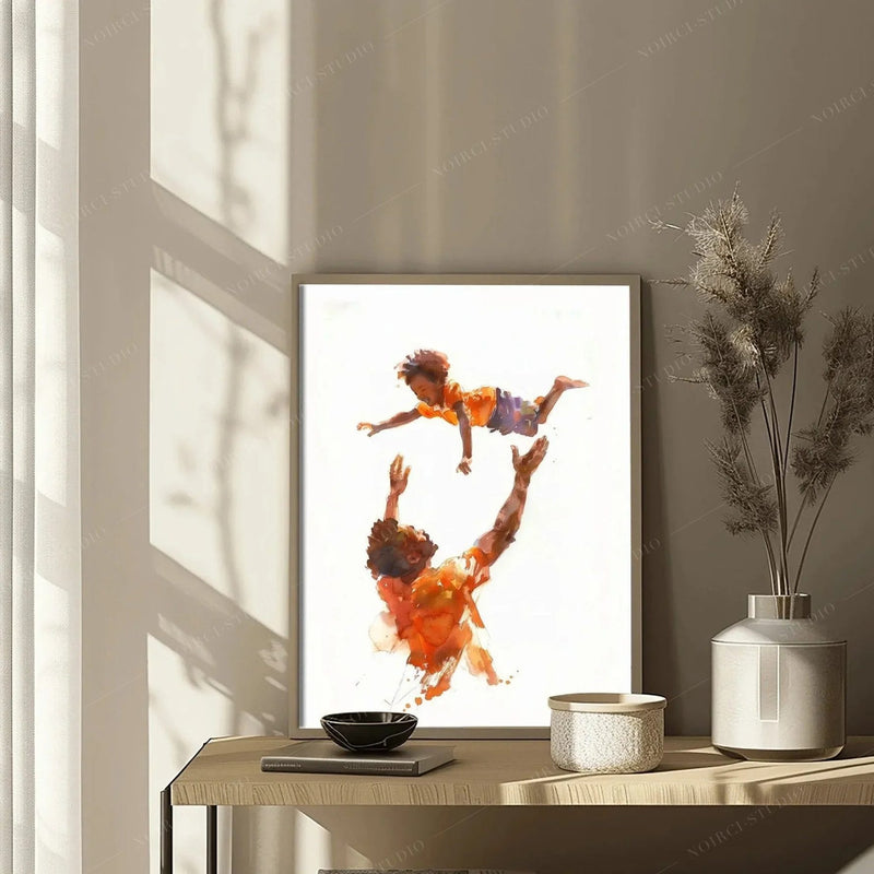 Detail of the dad tossing son painting on a console table with pampas grass in soft window light