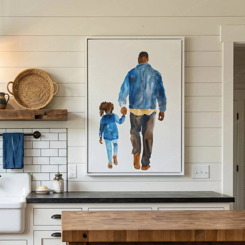 Black kitchen wall art, white framed watercolor of a father and child above a dark counter and white subway tile