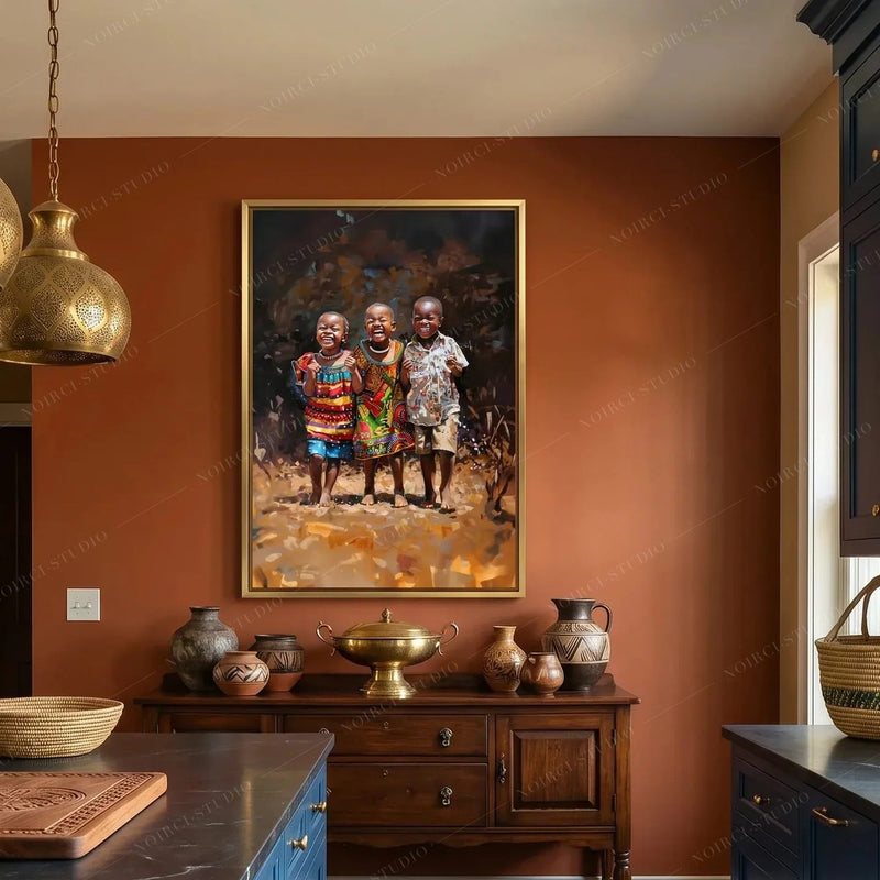 Black kitchen wall art, three laughing children in a gold frame on a terracotta wall above a wooden sideboard