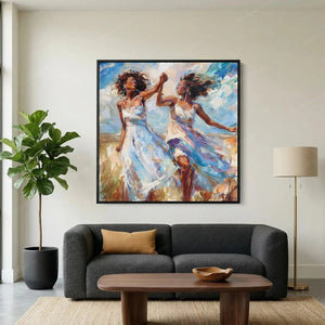 Black art for living room, women dancing painting above a charcoal sofa with camel pillow and fiddle leaf fig