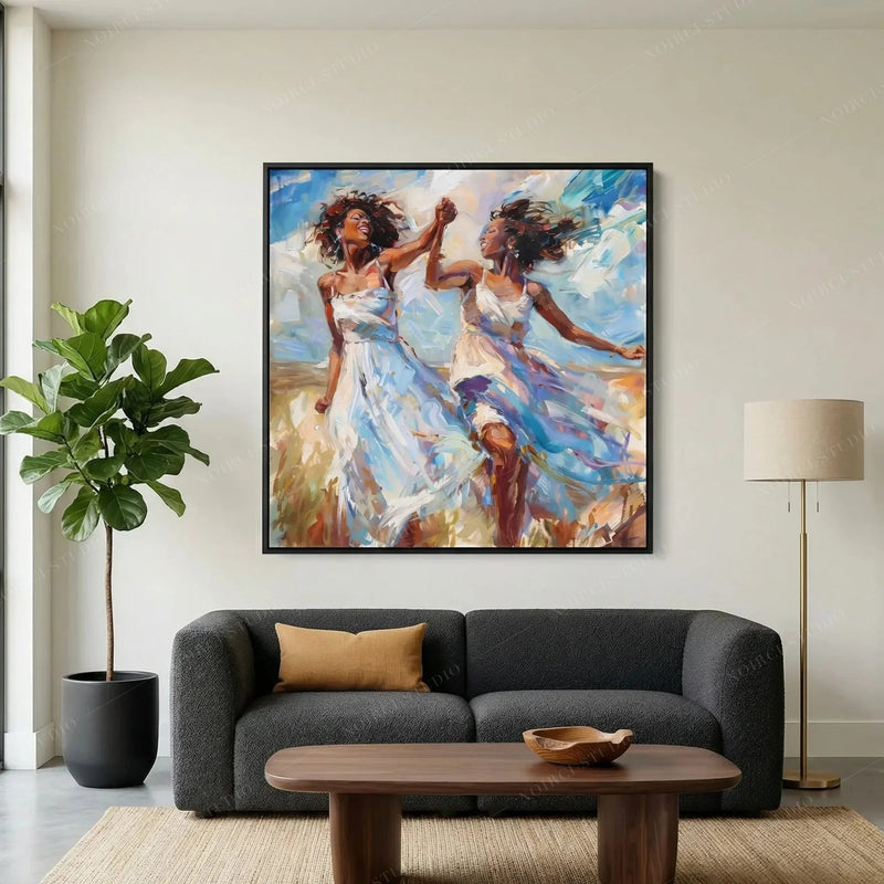Black art for living room, women dancing painting above a charcoal sofa with camel pillow and fiddle leaf fig