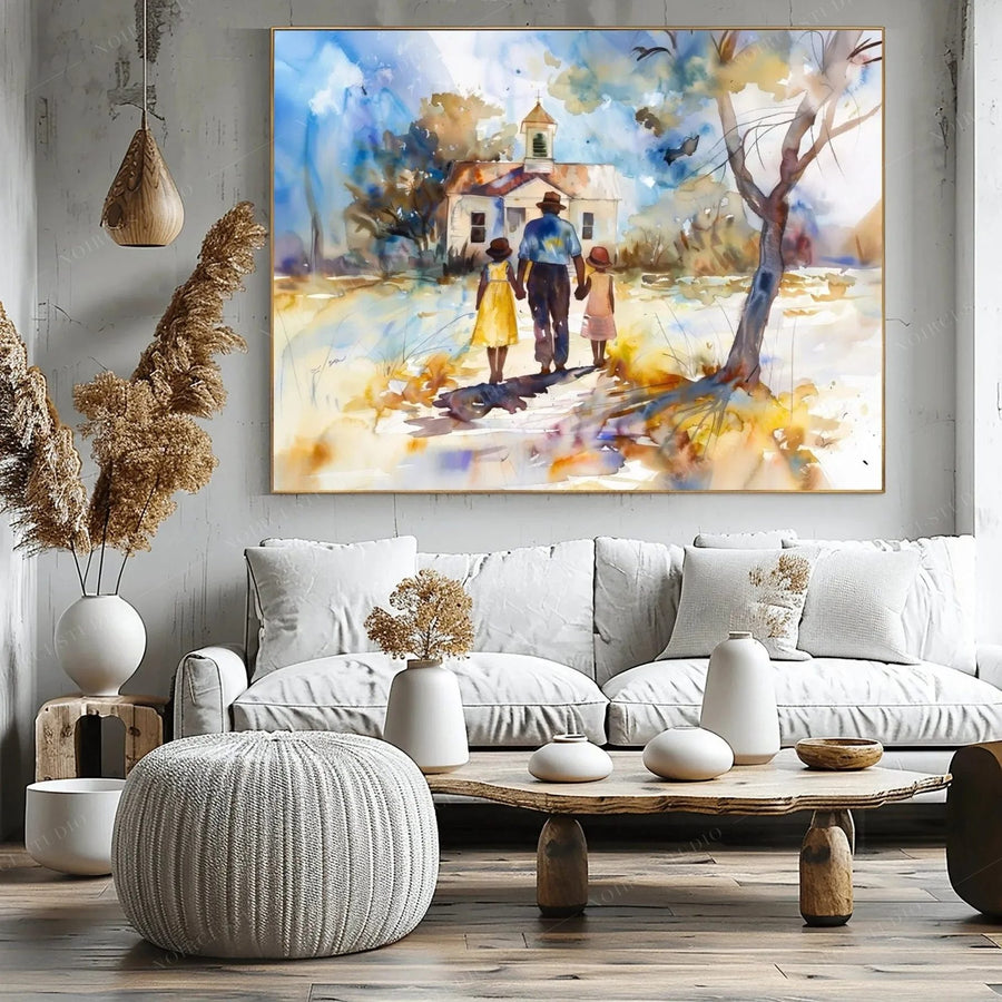 Black art for living room walls, family watercolor above a white sofa with pampas grass and a woven pouf