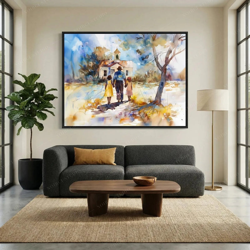 African American wall art above a charcoal sofa, chapel scene in a black frame beside a fiddle leaf fig