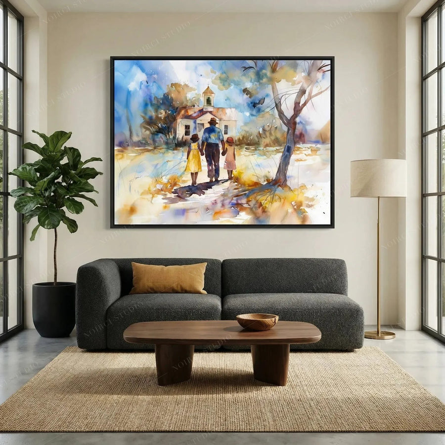 African American wall art above a charcoal sofa, chapel scene in a black frame beside a fiddle leaf fig