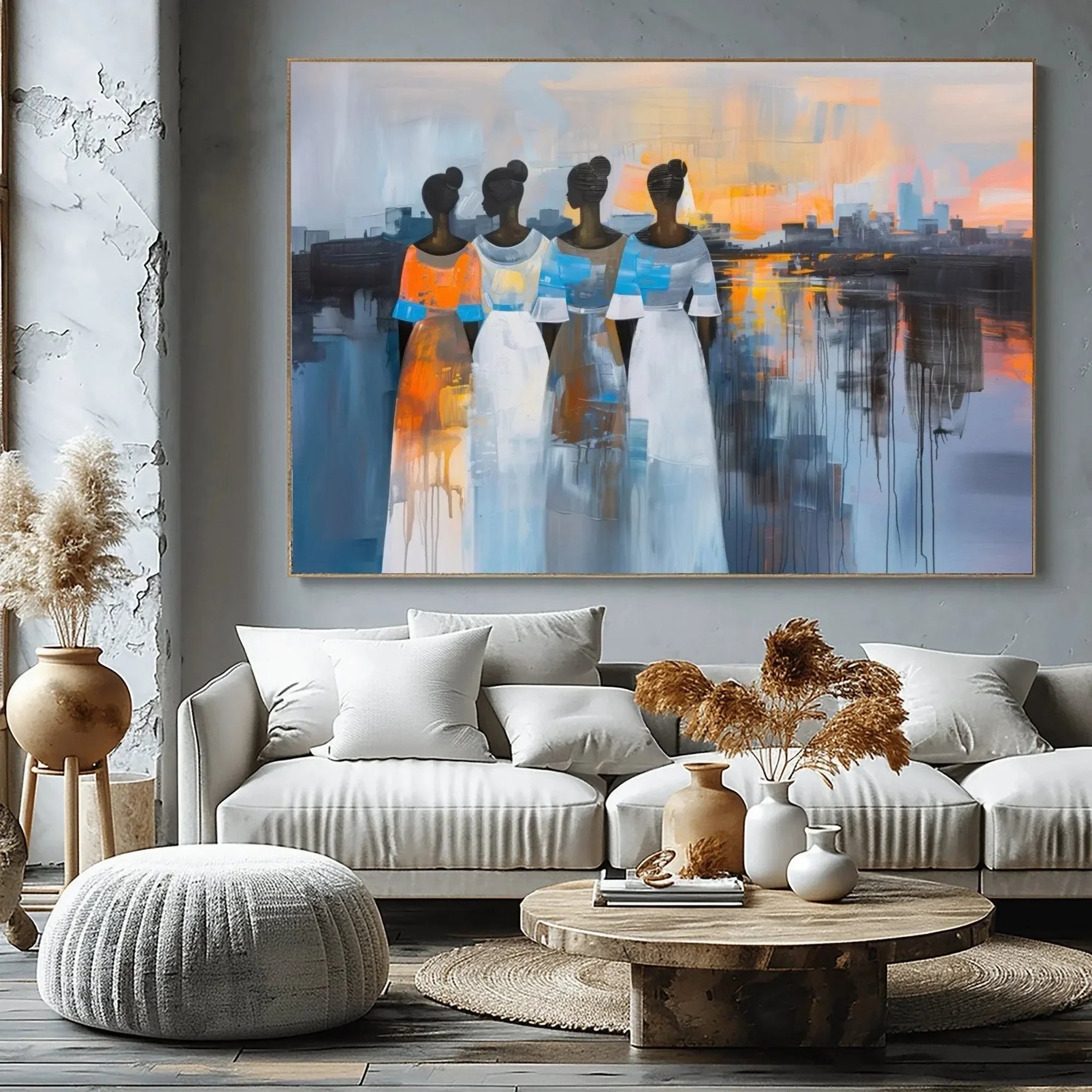 Black art for living room, four women at sunset above a greige sectional with pampas grass and a round wood table