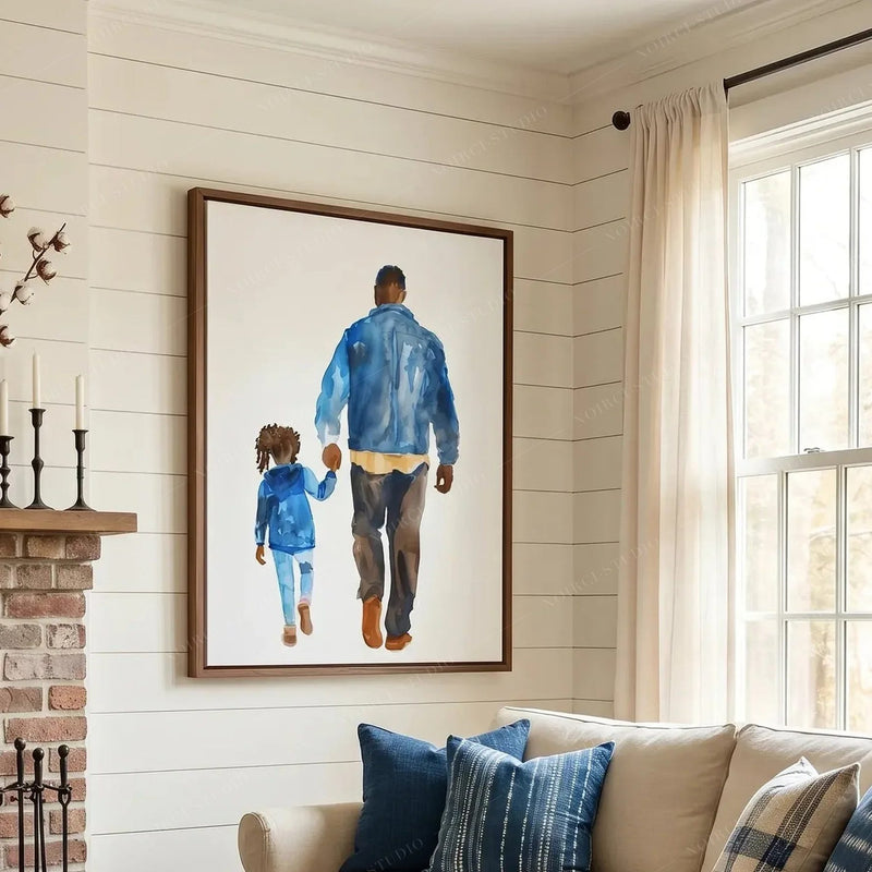 Black art for living room walls, framed father-daughter watercolor near a bright window and navy plaid pillows