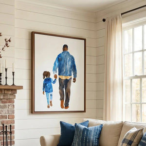 Black art for living room walls, framed father-daughter watercolor near a bright window and navy plaid pillows