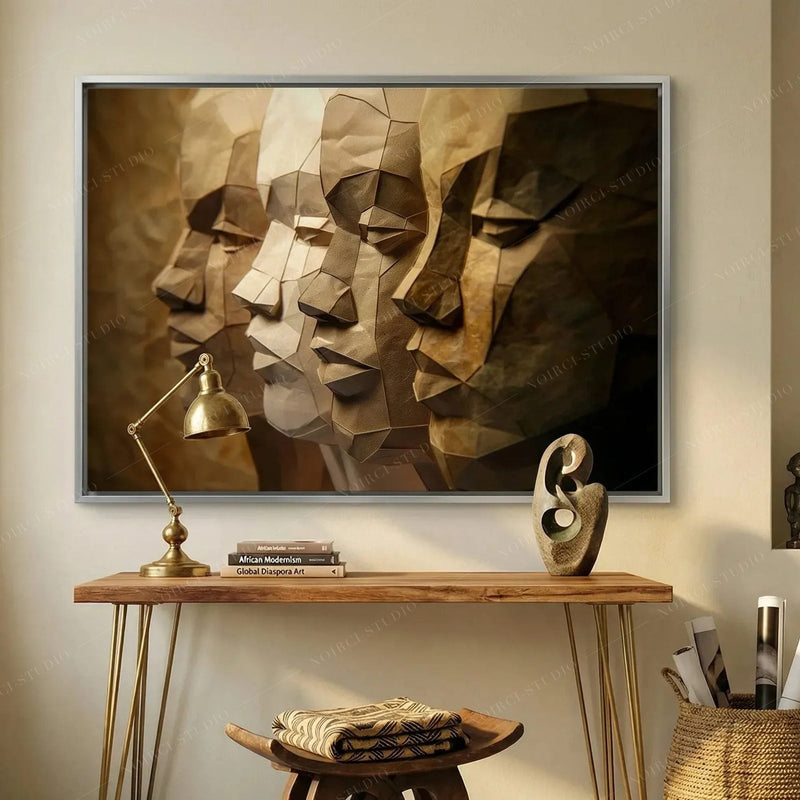 Silver-framed paper-craft portrait of four Black men above a hairpin-leg desk with a brass lamp and Black art books