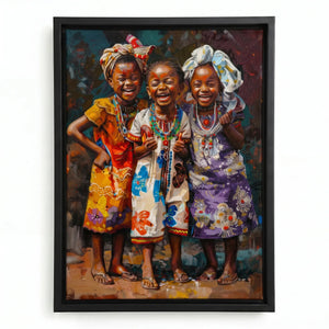 African canvas art in a black floating frame, three laughing African girls in floral dresses and beaded necklaces