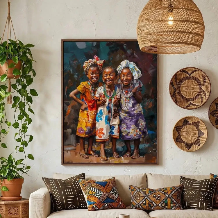 African wall art of three laughing girls in headwraps above a cream sofa with mudcloth pillows in a boho living room