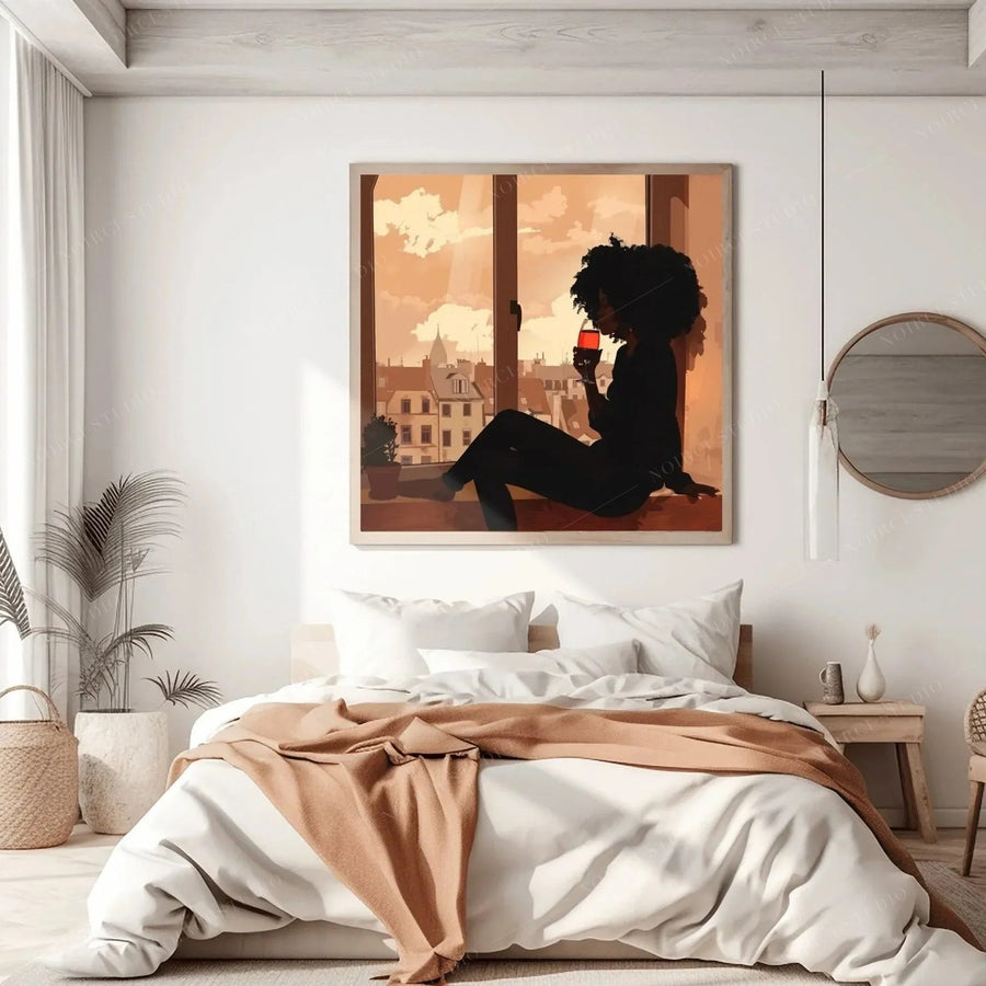 African American art for bedroom, framed print of a woman and wine glass above white bedding with a tan knit throw
