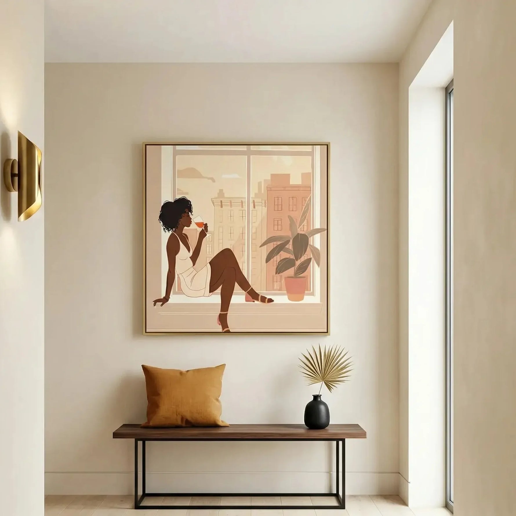 Black art for an entryway, wine at the window print above a walnut bench with a mustard pillow and brass sconce