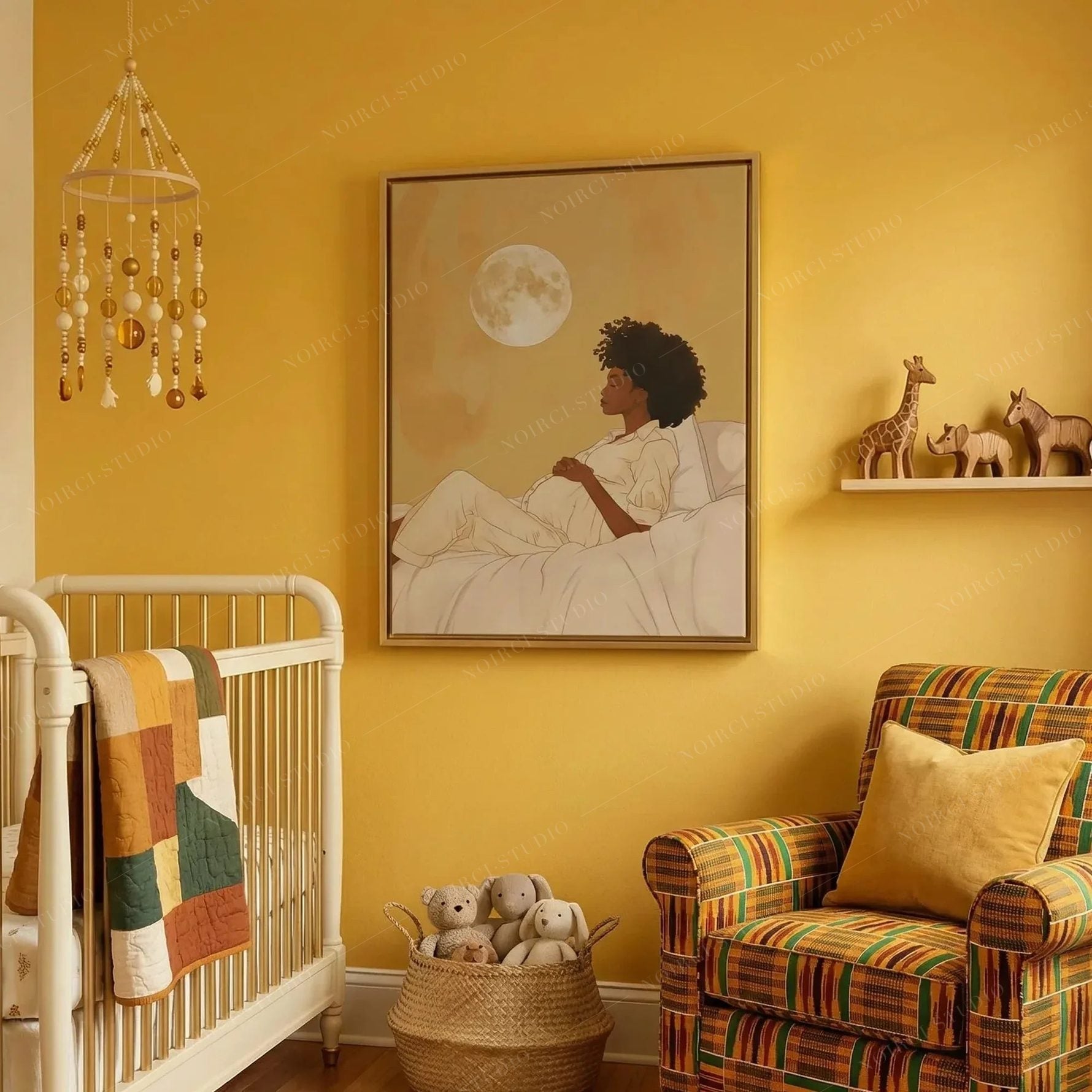 Maternity art for a yellow nursery, moon canvas near a white crib, kente armchair and a basket of teddy bears