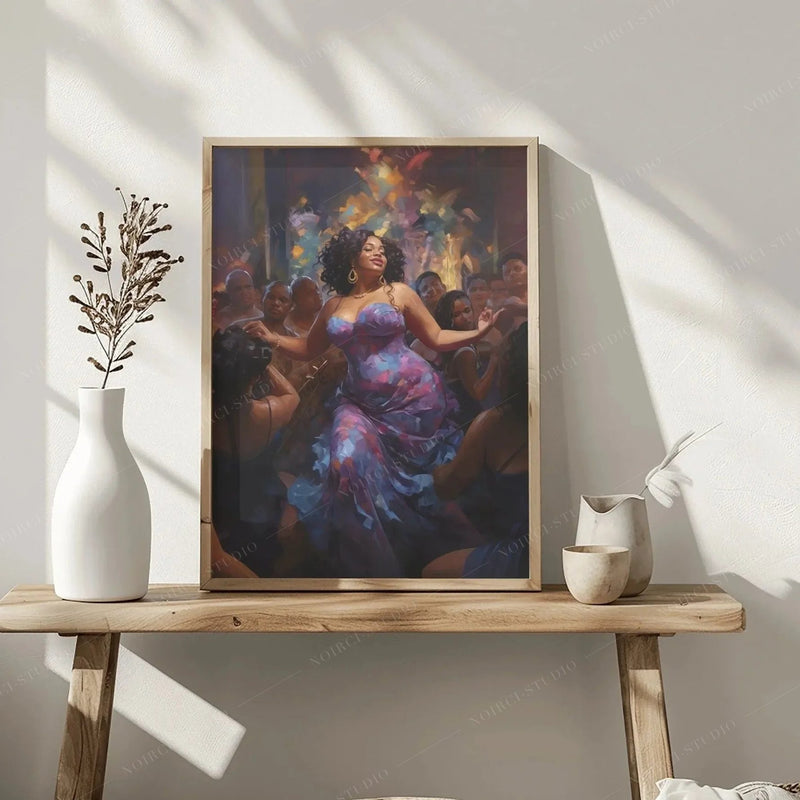Melanin dancer art in a wood frame styled on a rustic bench with white vases and dried botanicals