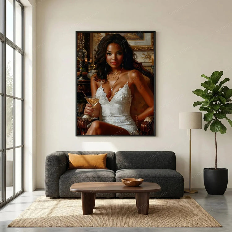 Melanin art canvas of a glamorous Black woman in a white slip dress with a martini, hung above a charcoal sofa
