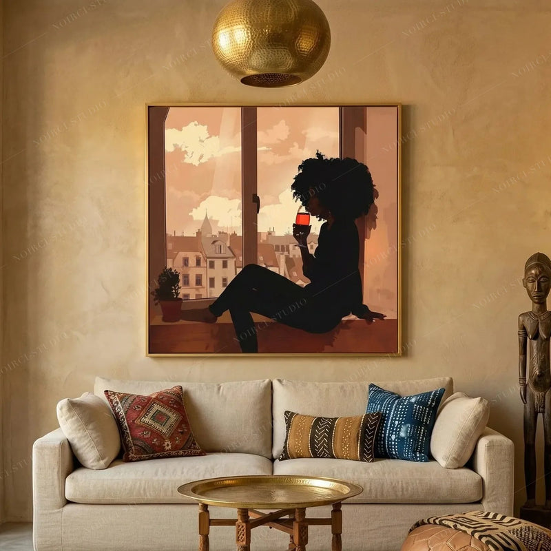 Afrohemian decor, gold framed Black woman wine painting above a cream sofa with kilim pillows and brass tray table