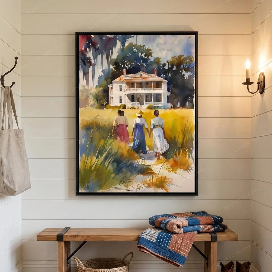 Gullah Geechee heritage art in an entryway, framed watercolor above a wooden bench with folded quilts