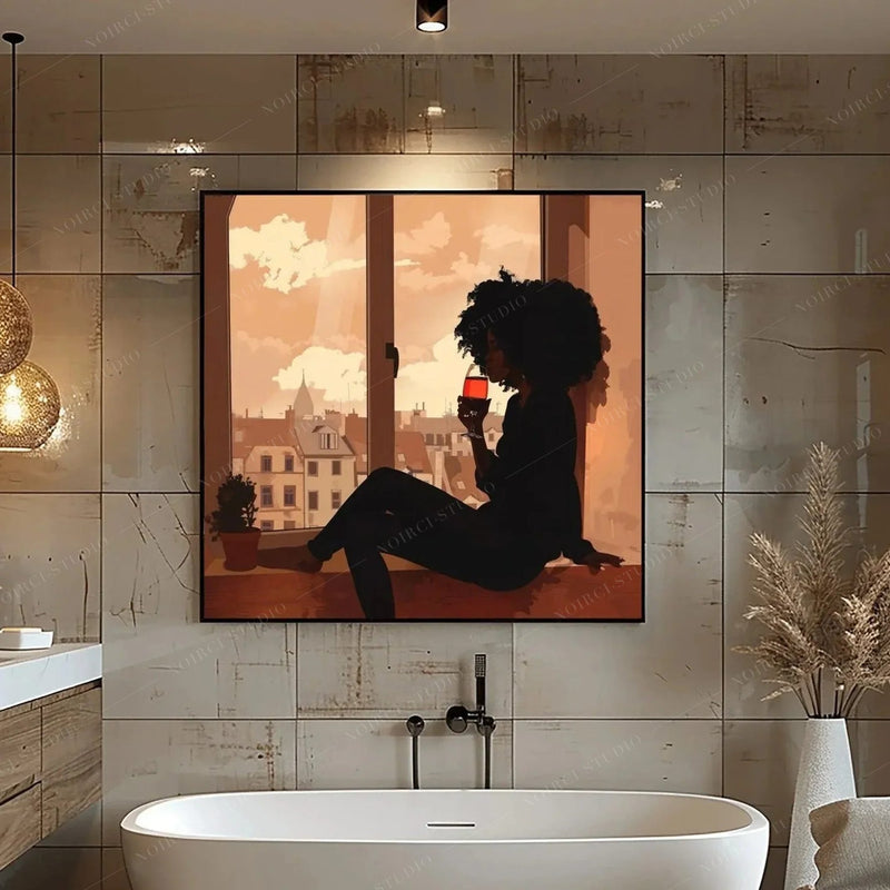 Black bathroom wall art, silhouette of a woman with red wine above a freestanding tub with brass fixtures