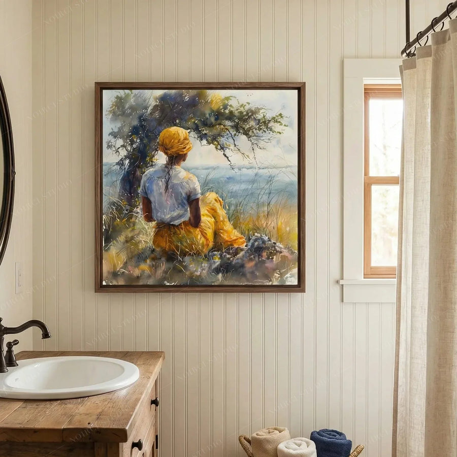 Black bathroom wall art, woman by the sea watercolor above a wood vanity with a white basin