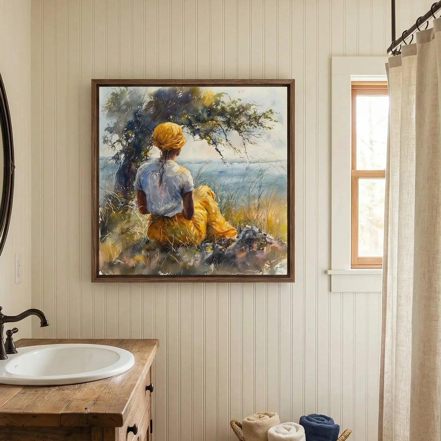 Black bathroom wall art, woman by the sea watercolor above a wood vanity with a white basin