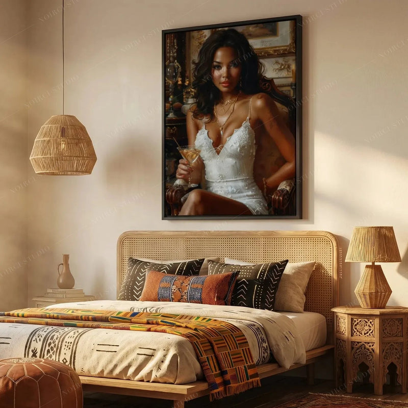 Afrohemian decor in a boho bedroom, framed portrait above a cane headboard with mudcloth pillows and a kente throw
