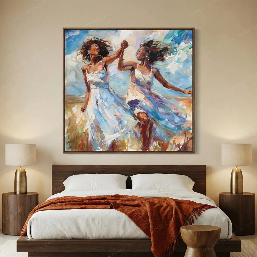 African American art for bedroom above a walnut bed with rust throw, two women dancing in white dresses