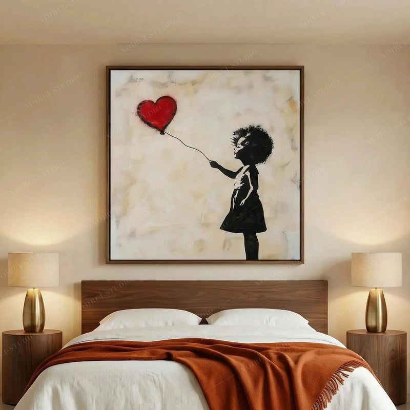 African American art for a bedroom, heart balloon girl in a walnut frame above a platform bed with a rust throw