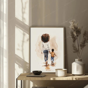 Black family portrait art in a slim frame leaning on a wood table by sheer curtains, watercolor of a mother and son
