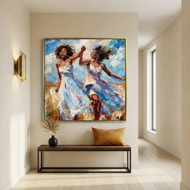 Black wall art in a minimalist entryway with brass sconce and wood bench, gold-framed painting of two women dancing