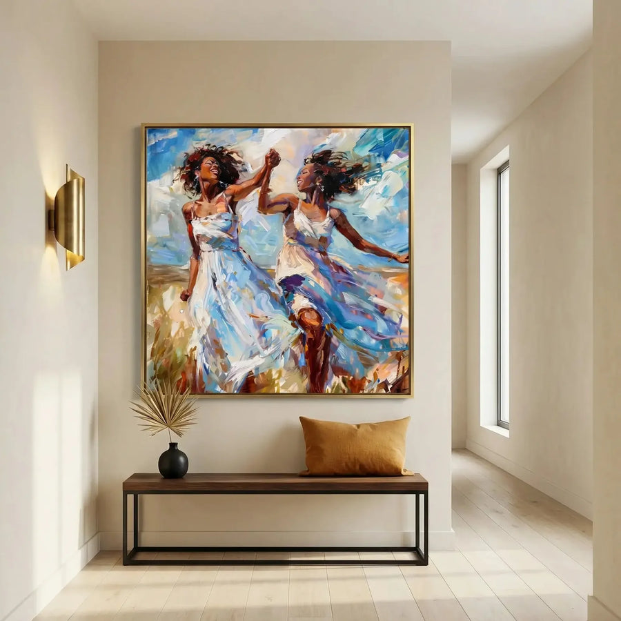 Black wall art in a minimalist entryway with brass sconce and wood bench, gold-framed painting of two women dancing