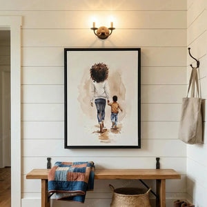 Black family wall art in a shiplap entryway with brass sconce, wood bench and denim quilt, mother and son watercolor