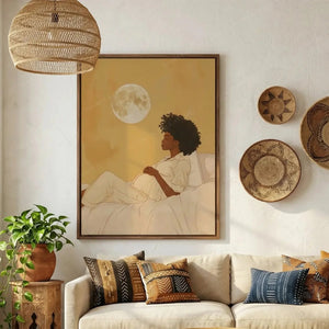 Black family artwork in a boho living room with woven wall baskets, mother-to-be resting beneath a glowing moon
