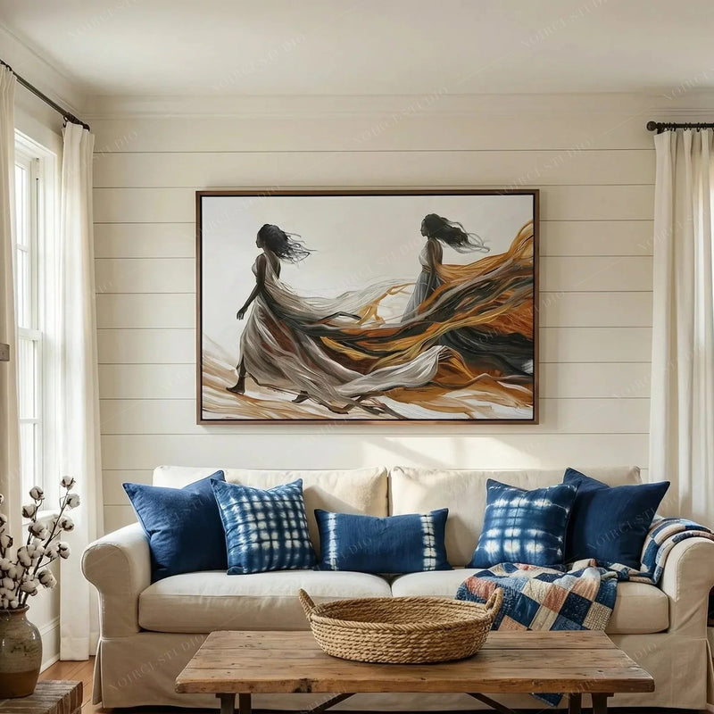 Black art for living room, women in flowing gowns canvas on white shiplap above a sofa with indigo shibori pillows