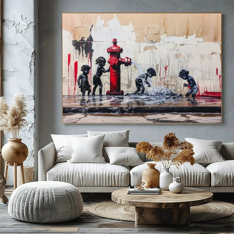 Black art for living room decor, hydrant summer scene above a gray sectional with pampas grass and a round wood table