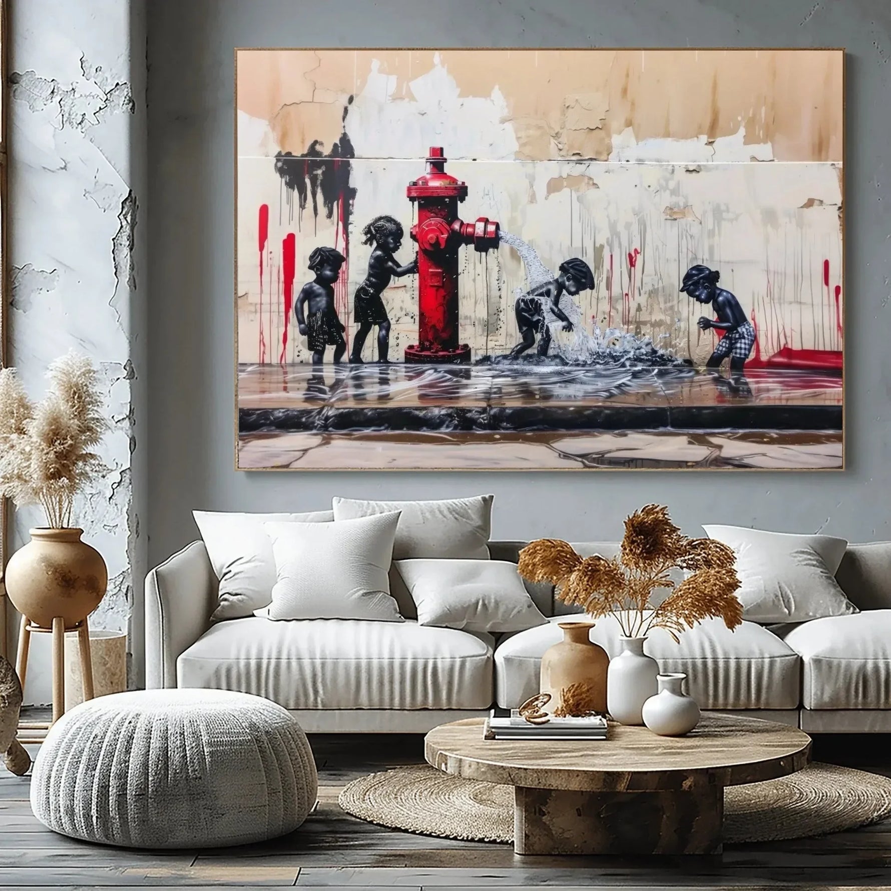 Black art for living room decor, hydrant summer scene above a gray sectional with pampas grass and a round wood table
