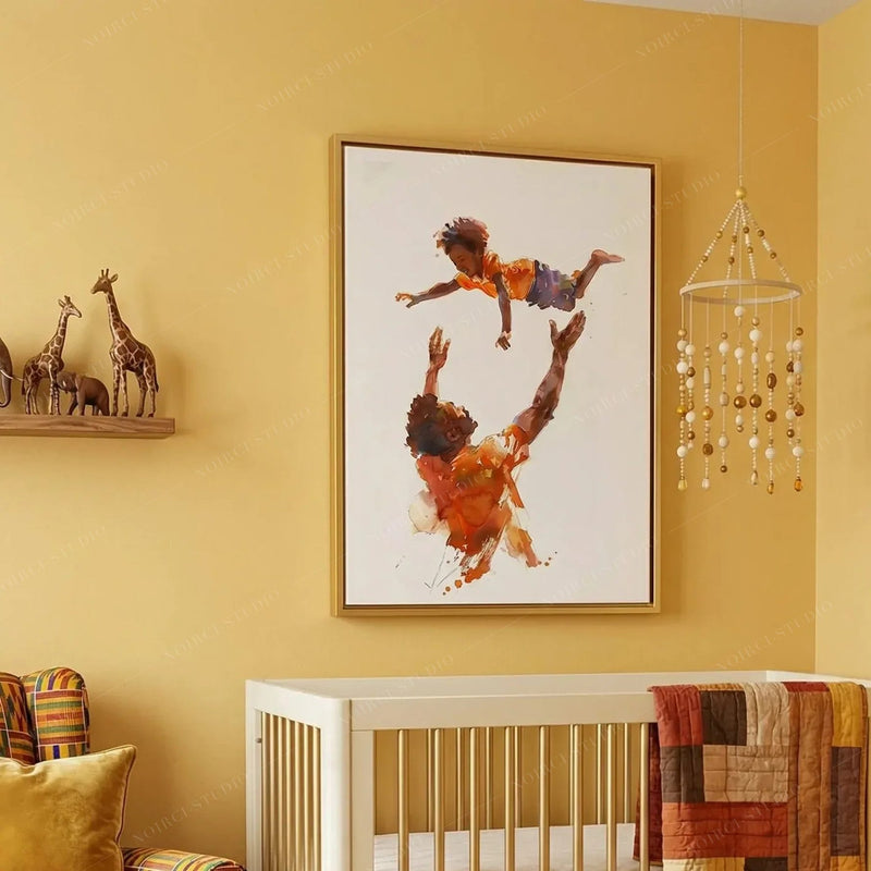 Black art for nursery walls, gold-framed dad and son watercolor on a mustard wall above a white crib and beaded mobile