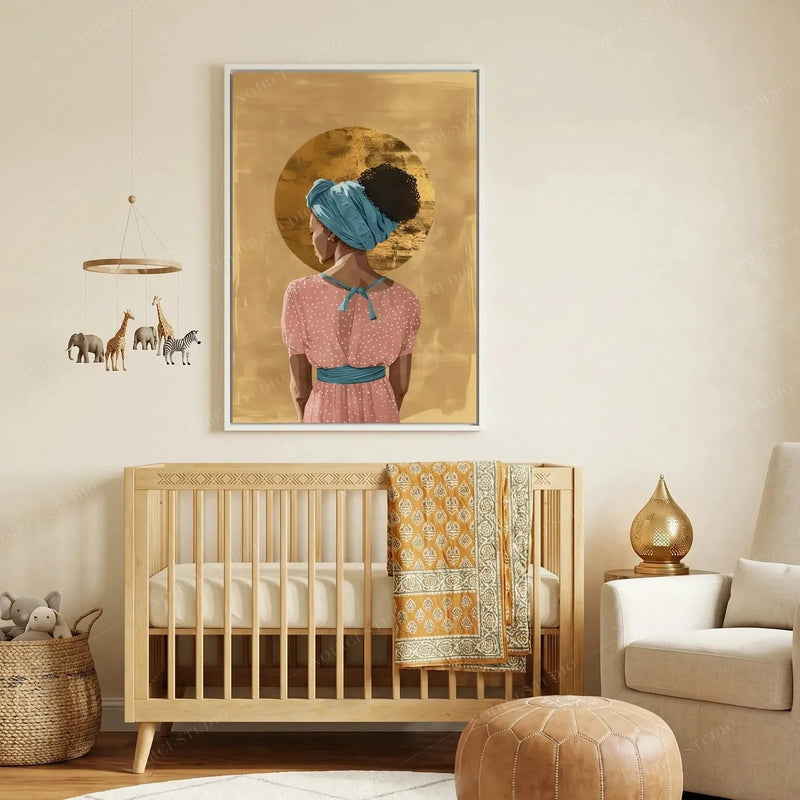 Black art for nursery walls, white-framed gold halo woman above a crib with safari animal mobile and orange quilt