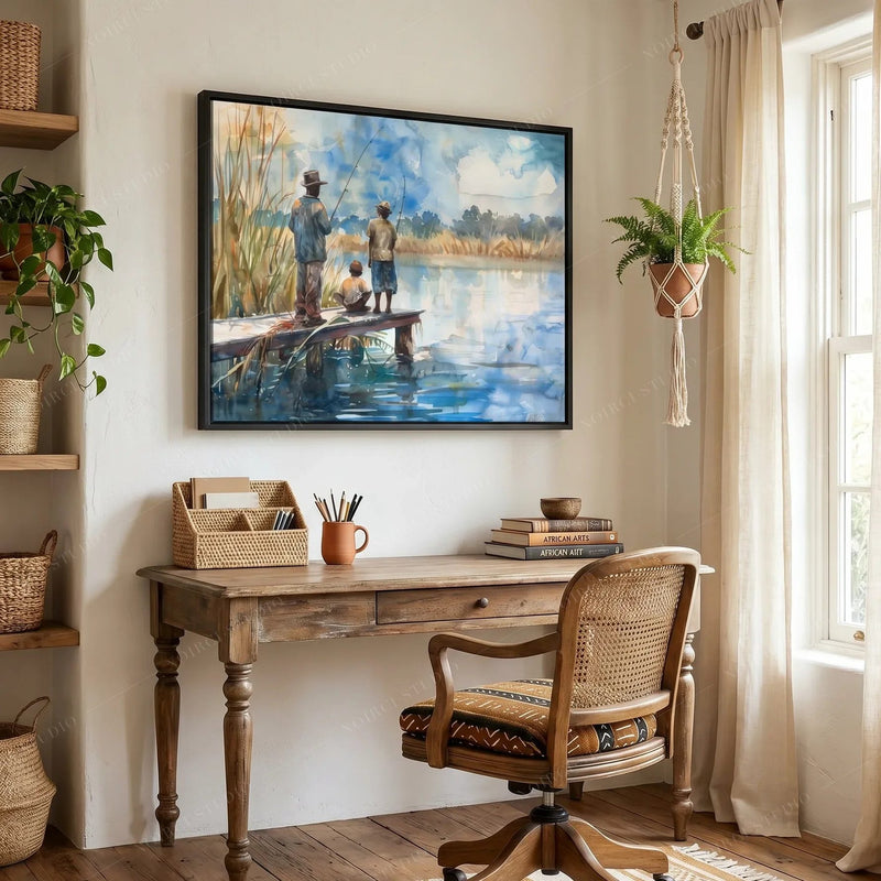 Afrohemian decor, riverside watercolor in a black frame above a desk with a rattan chair and macrame plant