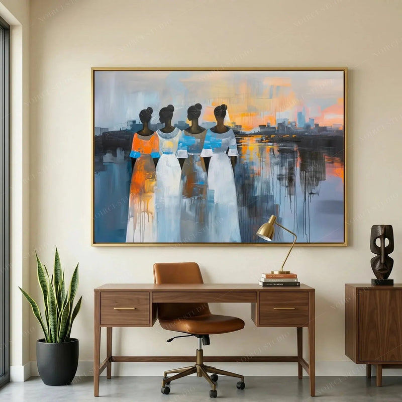 African American art for a home office, gold framed sunset painting above a walnut desk with a leather chair