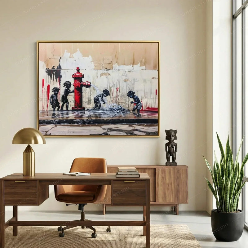 African American art for a home office, gold framed street scene above a walnut desk and carved wooden statue