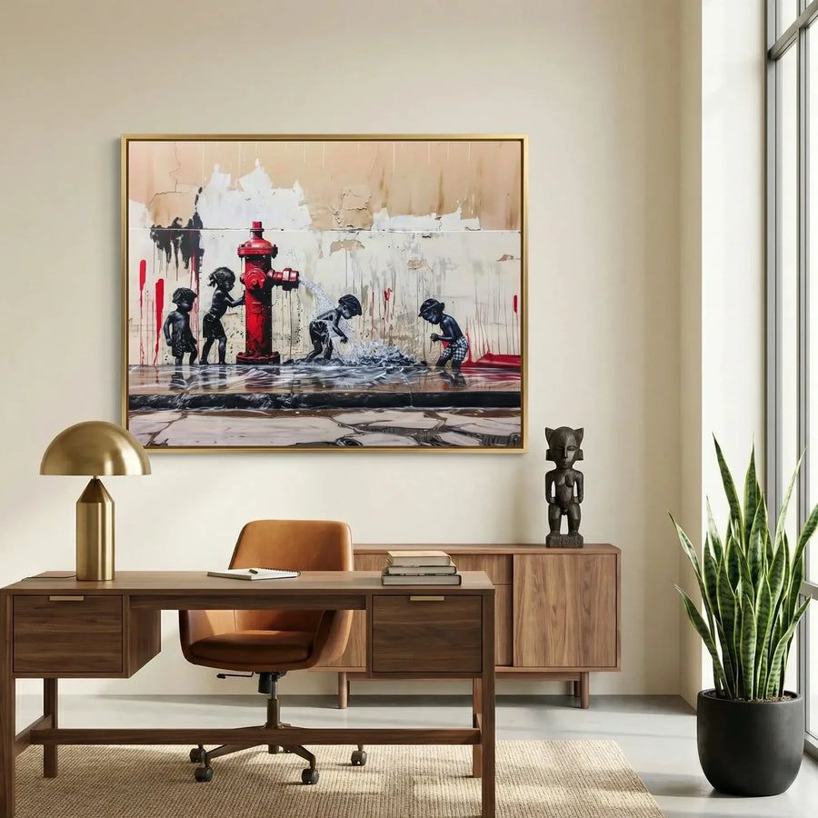 African American art for a home office, gold framed street scene above a walnut desk and carved wooden statue