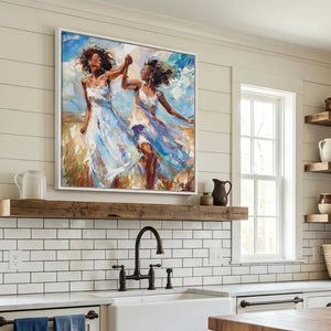Black kitchen wall art above a farmhouse subway tile backsplash and wood shelf, women dancing in white sundresses
