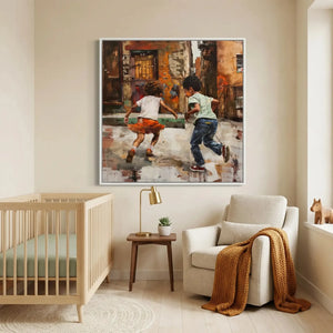 Black art for nursery walls, white framed alley scene above a light wood crib and boucle armchair with mustard throw